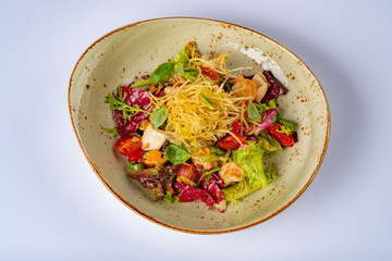 Healthy salad plate. Fresh seafood recipe. mussels, squids and fresh vegetable salad and chips. Healthy food.