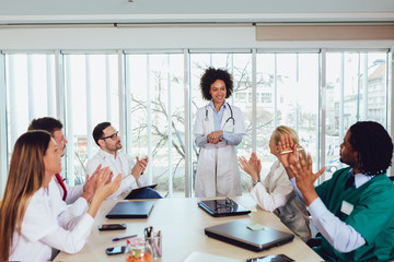 Fototapeta premium Medical team sitting and discussing at the table in the office.