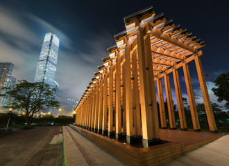 Pavilion in public park and Skyline of Hong Kong city at night