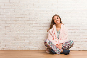 Young woman wearing pajama cheerful with a big smile