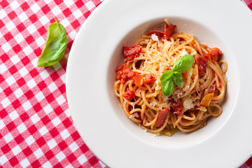 Spaghetti with tomato sauce, cheeese and fresh basil