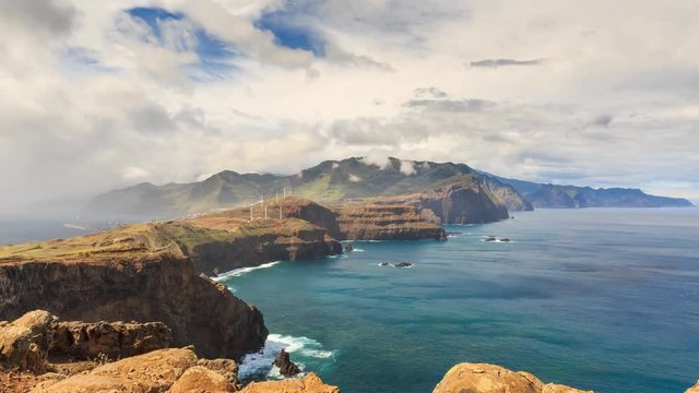 Beautiful 4K UHD timelapse video of moving storm clouds at sunset on the island Madeira at Ponta de Sao Lourenco nature reserve in summer