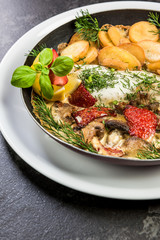 Grilled fish with fried potatoes, restaurant serving dish