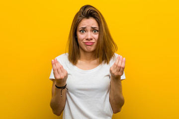 Young natural caucasian woman showing that she has no money.