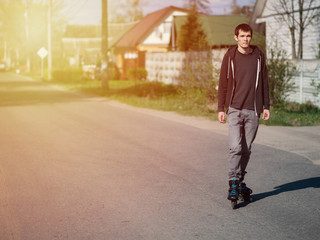 A man on roller skates riding around the city