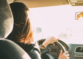 Fototapeta Young brunette long hair woman driving passenger car obraz