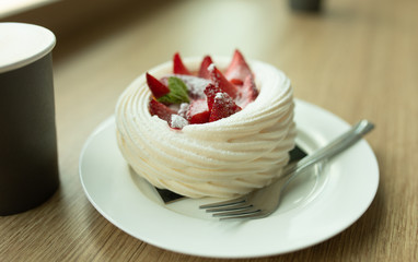 Homemade strawberry shortcake topped with fresh strawberry,