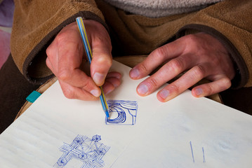 Man hands drawing sketch with pen. Abstract art work.