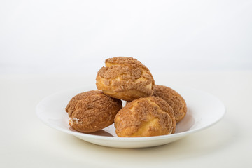 There are delicious puffs and milk on the table