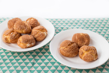 There are delicious puffs and milk on the table