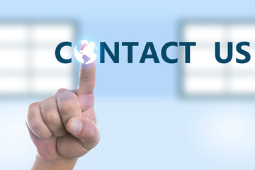 Person touching contact us button on display