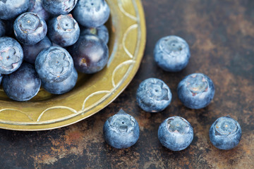Healthy eating, blueberries natural antioxidant fruits, snack foods on metal grunge background