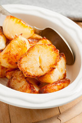 Home made roast potatoes oven cooked in beef fat until crisp and golden a favourite side dish with Sunday dinners