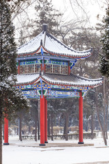 There is a pavilion in the snow in winter