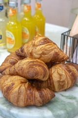 Freshly baked croissants on a marble  board