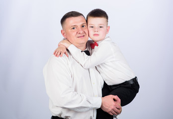 small boy with dad gentleman. family day. happy child with father. business meeting. male fashion. parenting. fathers day. father and son in formal suit. tuxedo style. Wedding party. happy family day