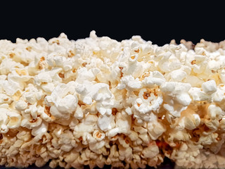 Popcorn texture background for retouch . salty popcorn in the box .