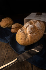 food background of assortment of bread on napkin on wooden table