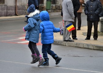 Parade in Romania - a national holiday, people with flags