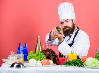 Bearded man cook in kitchen, culinary. Vegetarian. Mature chef with beard. Healthy food cooking. Fatty meal. Dieting and organic food, vitamin. Chef man in hat. Secret taste recipe