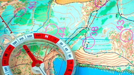 Orienteering. Compass and topographic map. Navigation equipment for orienteering. The concept.