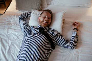 Manager rests after a long day. Boss relaxing at the hotel. 
