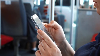 Woman texting on a smartphone during bus trip in slow motion 120fps - Powered by Adobe