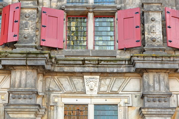 Naklejka premium Details of the external facade of the Town Hall (rebuilt in 1629) in Delft, Netherlands, with carvings