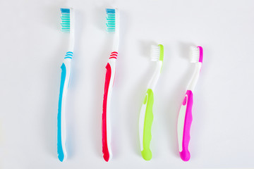 Toothbrushes on neutral background. Family hygiene concept.