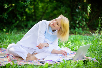 Woman with laptop or notebook sit on rug green grass meadow. Online business ideas concept. Business picnic concept. Steps to start freelancing business. Business lady freelancer work outdoors