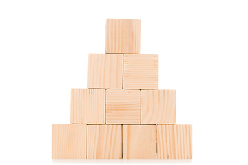 pyramid made of wooden blocks with copy space isolated on white