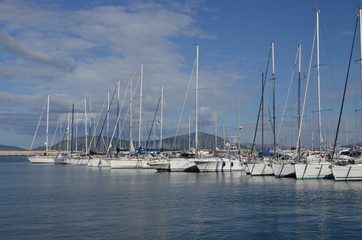 Fototapeta na wymiar White boats in Alghero harbor