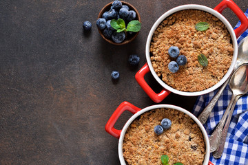 Cherry crumble on concrete background. View from above.