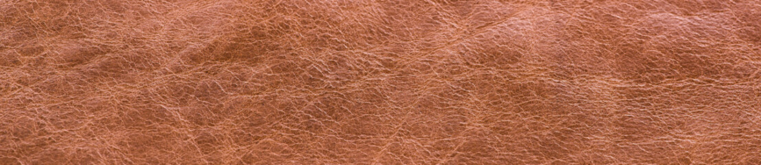 Fototapeta na wymiar Brown leather texture closeup background