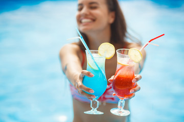 Very beautiful young woman in the swimming pool