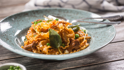 Italian pasta mafalde mushrooms peas and tomato sauce