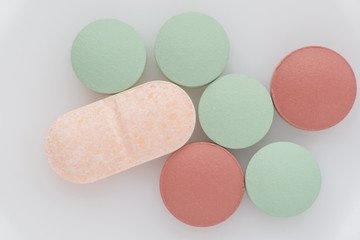 Pills on a light background close up. View from above.