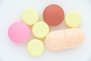 Pills on a light background close up. View from above.