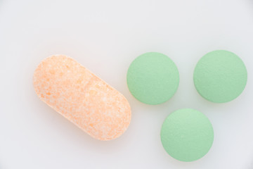 Pills on a light background close up. View from above.