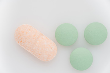 Pills on a light background close up. View from above.