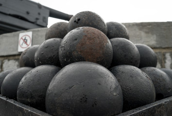 A stack of old cannon balls at a fort