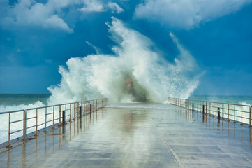 Wave breaking on the lighthouse. © Antonio