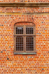 Brick wall of old castle with window
