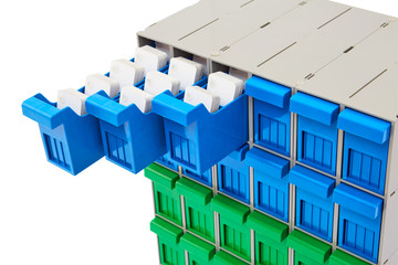Fototapeta premium Green and Blue Plastic storage bins for screws and bolts on white background