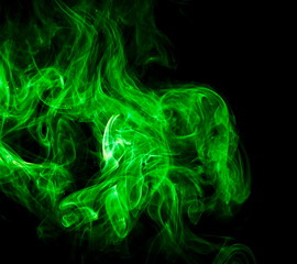Green smoke on black background