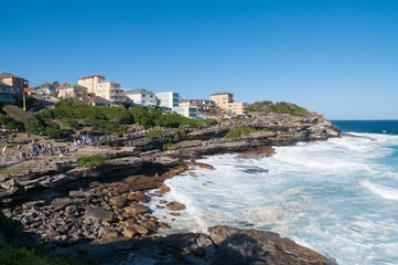 People walking on footpath between Tamarama and Bondi beach in Sydney