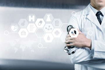 Portrait of  doctor  with arms crossed in medical office