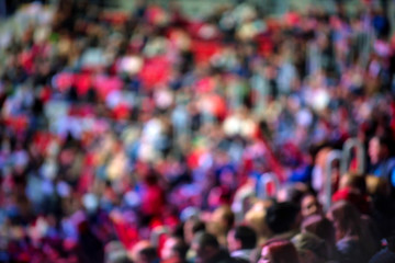 Many spetators gathered at hockey match blurred image
