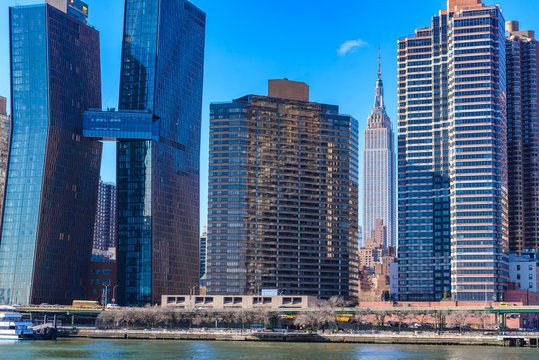 View from East Side River to Empire State Building - Manhatten Skyline of New York, USA