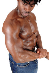 The close up sweaty torso of a black man bodybuilder